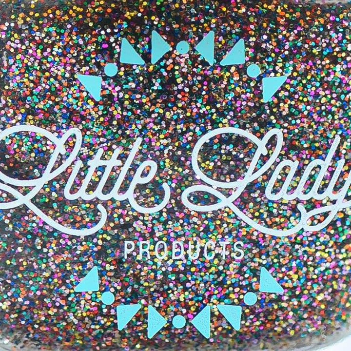 close up look at the small multi color glitter nail polish. 