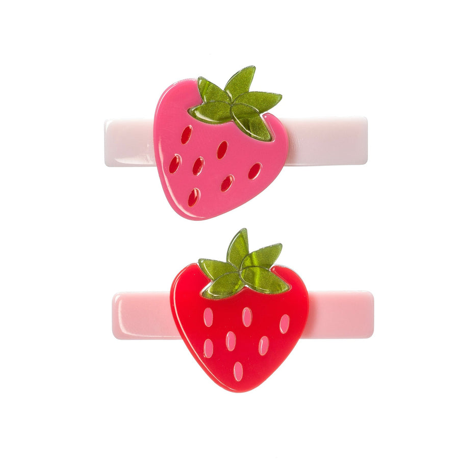 Two strawberry-shaped hair clips on a white background