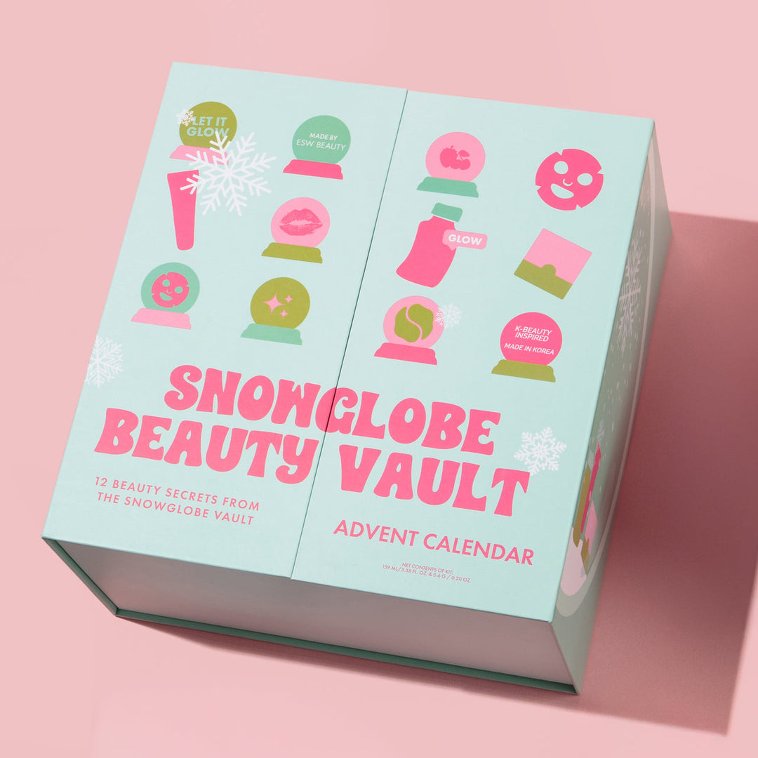Snowglobe Beauty Vault Advent Calendar packaging on a pink background