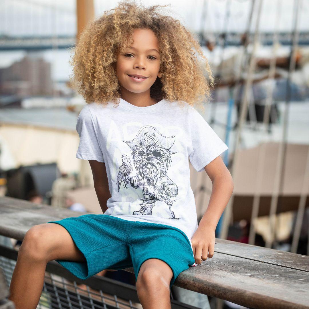 young boy modeling the gray appaman pirate tee. 