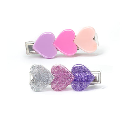 pink and purple hearts on each clip, one clip has solid color hearts and the other is glitter