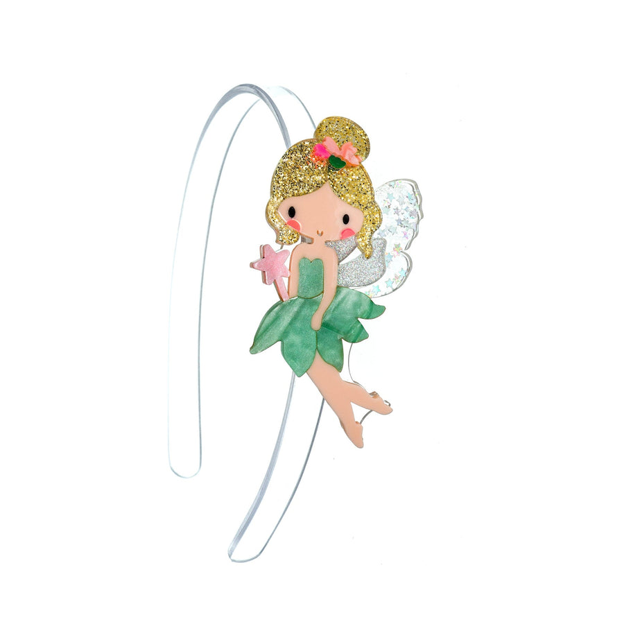 Fairy figurine headband with green dress and pink hair accessory on a white background