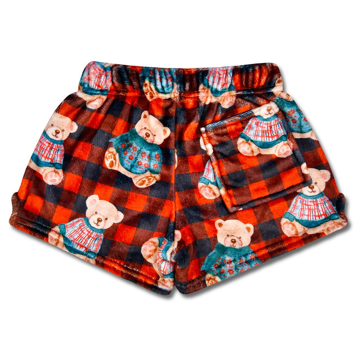 Plaid shorts with teddy bear pattern on a white background