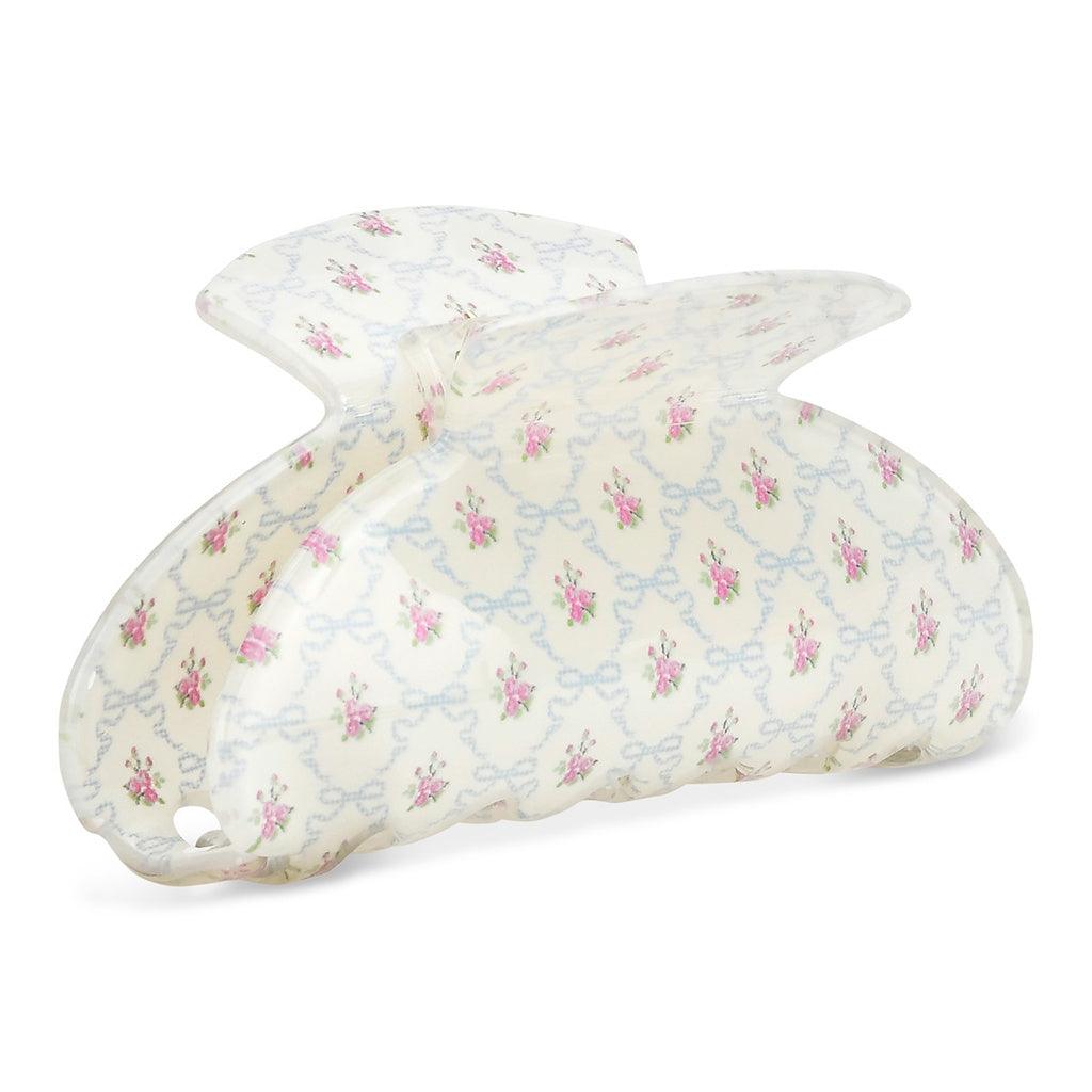 white claw clip with pink floral print on the clip