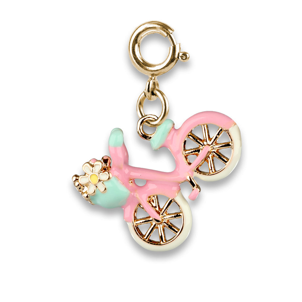 Pink bicycle charm with gold accents on a white background