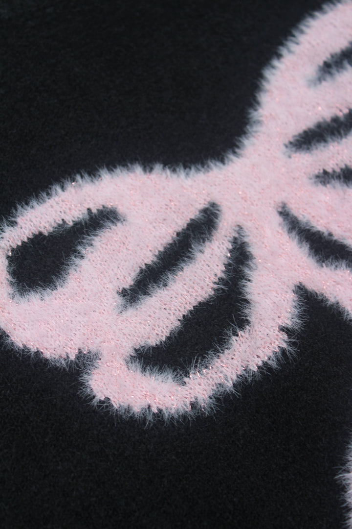 Close-up of a bow pattern on a black background