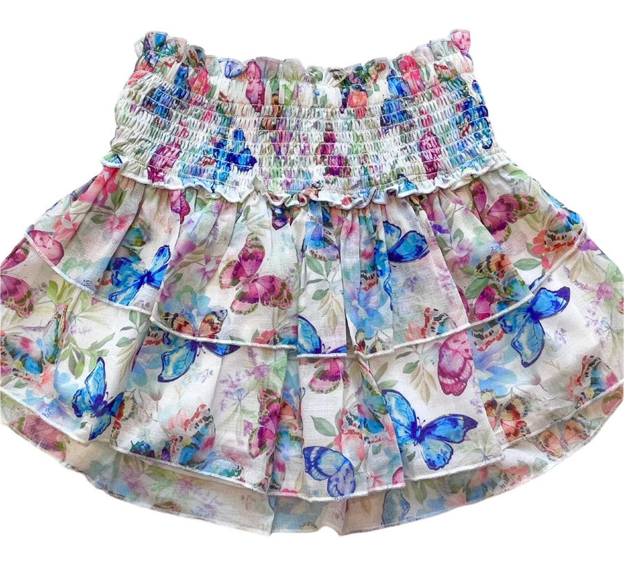skirt with smocking at the top and 2 layers of the skirt that have butterflies on them: blue, pink and magenta. 