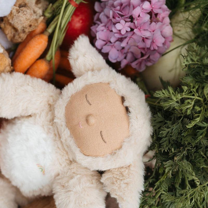 lamb doll playing in the grass. 
