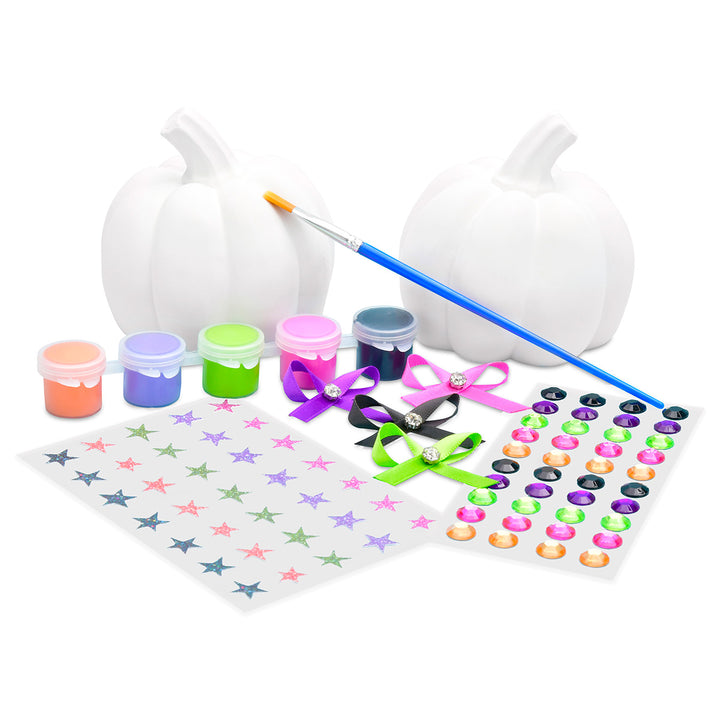 white pumpkins, paint cans, a brush, and decorative items on a white background.