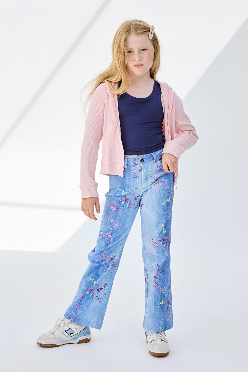 little girl wearing denim splatter pants twill pants 