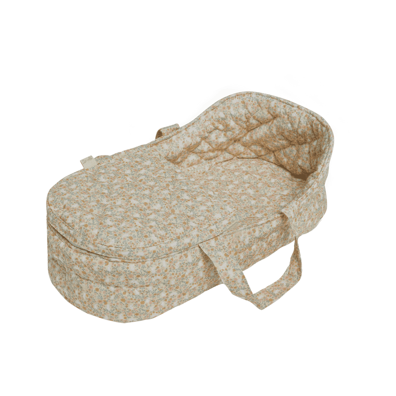 beige floral carry cot with handles 