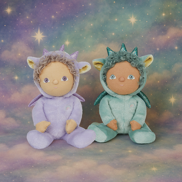 Two plush toys, one in a purple outfit and the other in a green outfit, against a starry sky background.