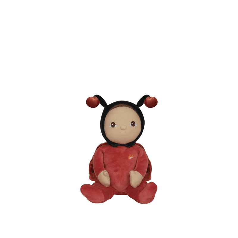 baby doll dressed as a red ladybug with wings and antannae. 