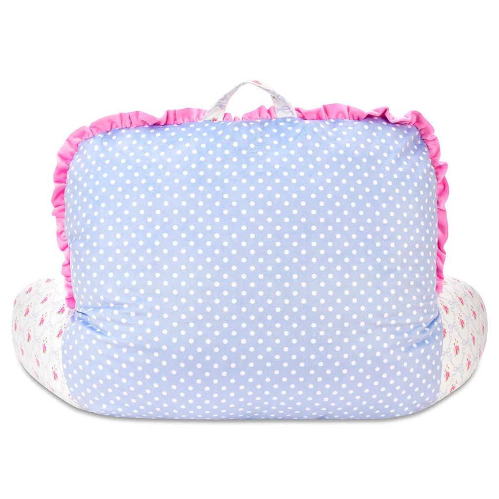 back of lounge pillow where the back of the pillow is polka dots and the front is blue floral pattern. 