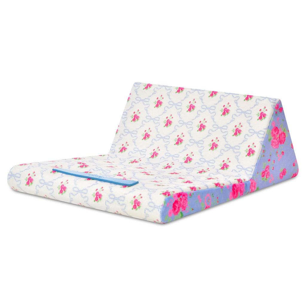 tablet pillow in its extended form white floral in the middle and blue floral on the edges. 