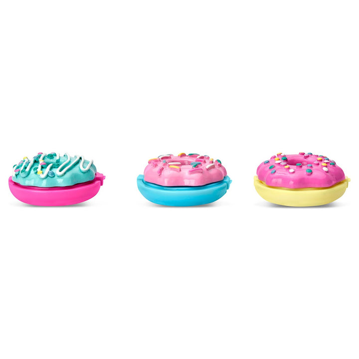 Three colorful donut-shaped toys on a white background