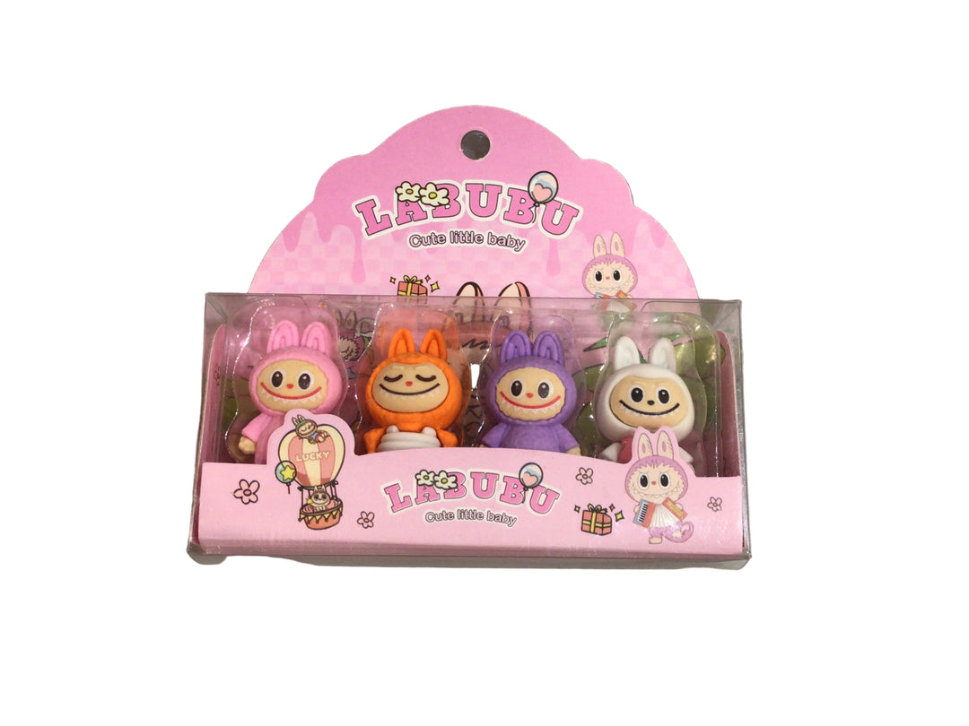 Set of cartoon eraser figurines in a pink packaging on a marble surface