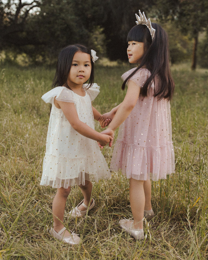 This picture shows this dress in the champagne and rose color way on two little girls. 