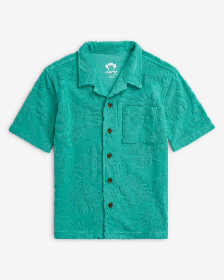 Green short-sleeve shirt with button details on a white background