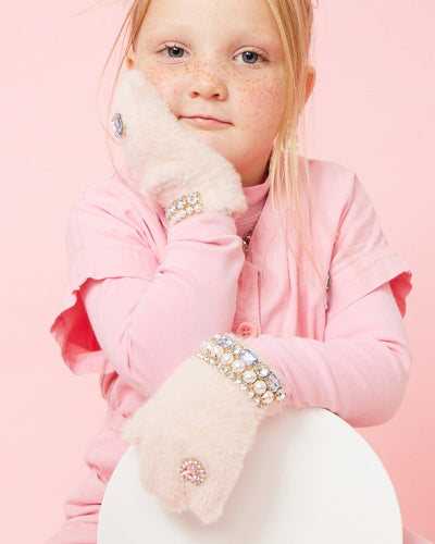 Little girl modeling the pink gloves with rhinestones and pearls. 