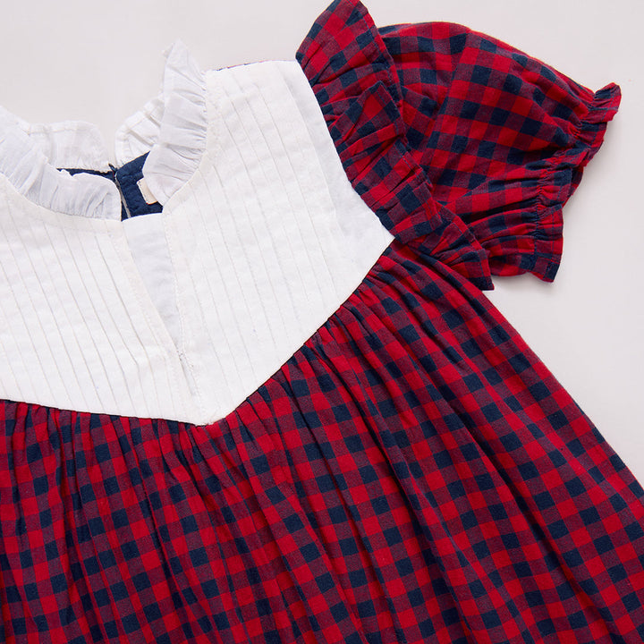 Red and blue plaid dress with white top 