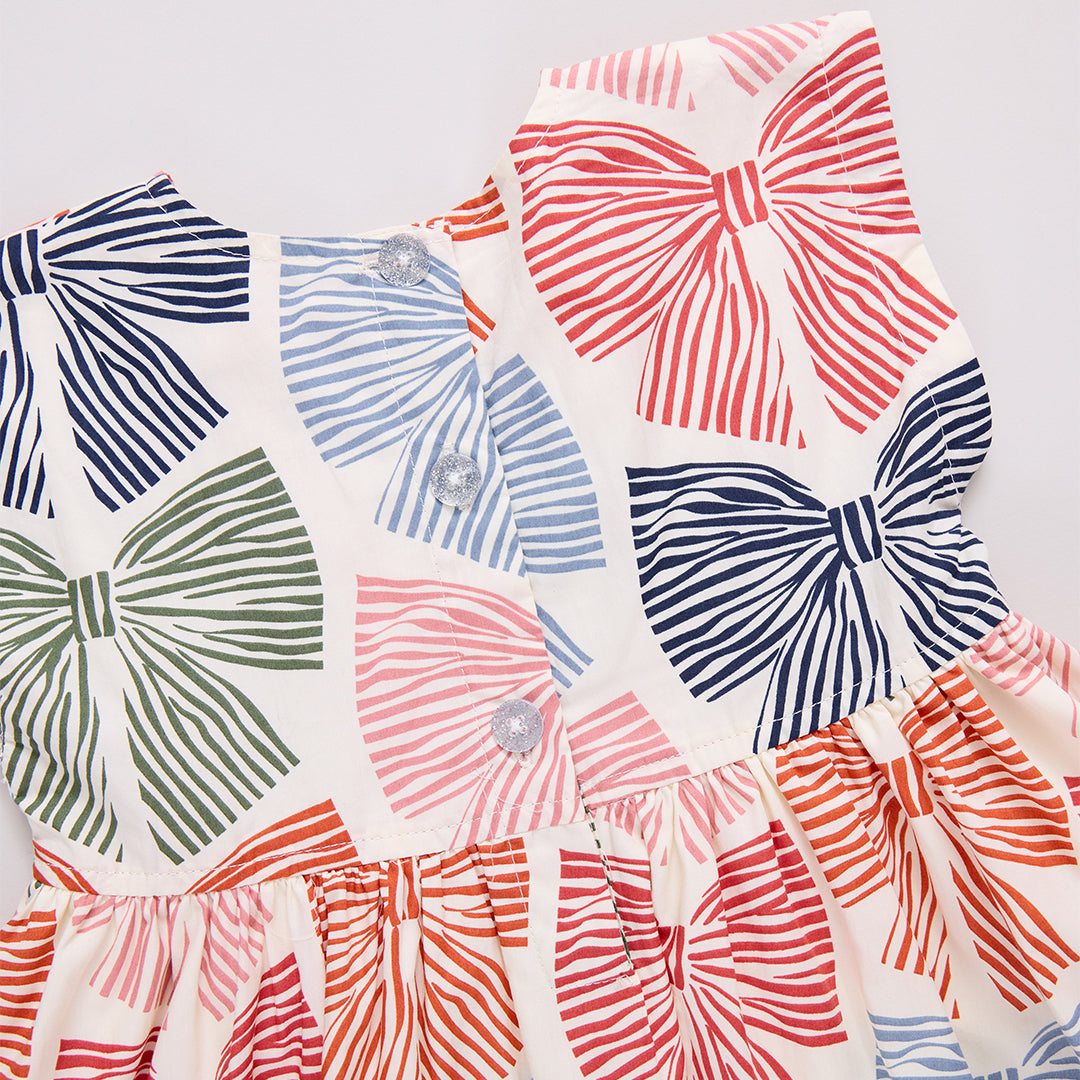 Colorful bow-patterned dress: red, blue, navy, and green bow print 