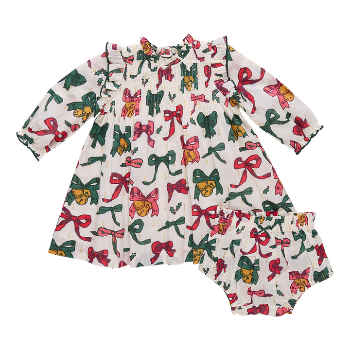 Children's dress with colorful bow pattern on a white background
