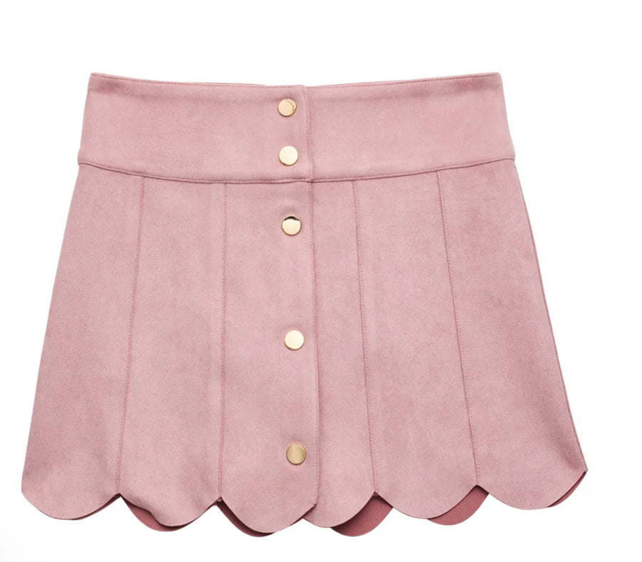 Pink skirt with scalloped hem and gold buttons on a white background
