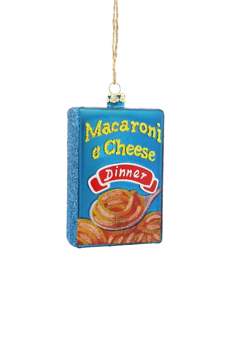 Macaroni and cheese dinner ornament with accents of glitter on the box/ornament