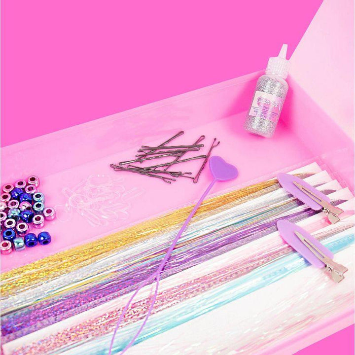 tinsel, sprkel and beads inside the kit, a close up look at the materials 