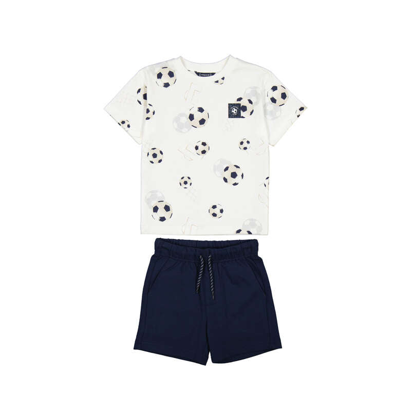White t-shirt with soccer ball pattern and navy shorts on a white background