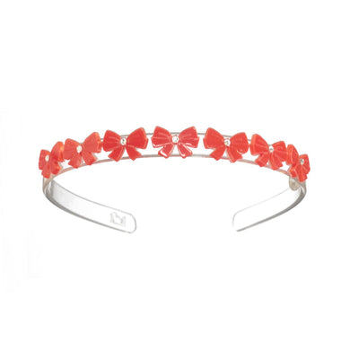 acrylic headband with red bows lined up along the top of the headband