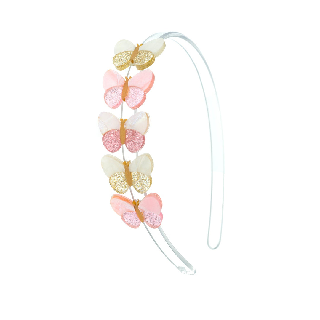Butterfly-shaped headband with pink, gold, and white butterflies on a white background
