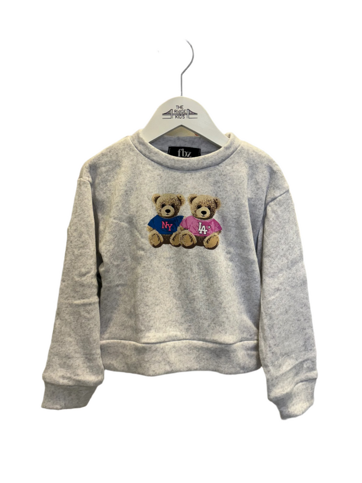 long sleeve ray sweatshirt with two teddy bears on the front, one wearing a t-shirt that says "LA" and the other that says "NY" 