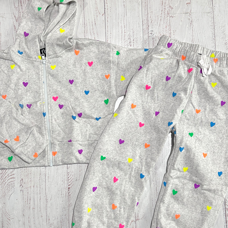 matching set, misty gray with all over neon heart design. this picture shows the zip hoodie and joggers. 