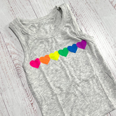 sleeveless tank gray color with neon hearts across the middle of chest. 