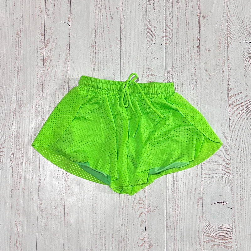 bright green mesh shorts with spandex shorts underneath