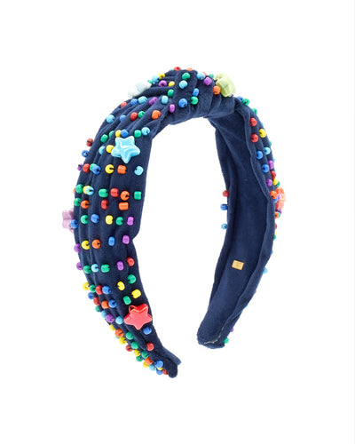 navy velvet knotted headband with primary colored beads sewn all over it. a star placed randomly throughout. 