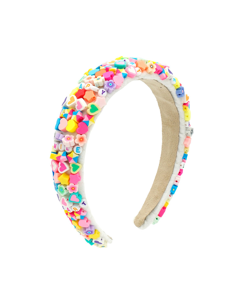 beaded headband with colorful beads in all different shapes but bright colors. There are words spelled out on the headband like a friendship bracelet. 