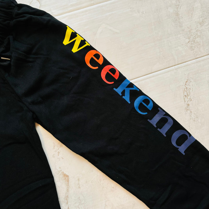 Picture shows a close up of the graphic WEEKEND word on sweatpant