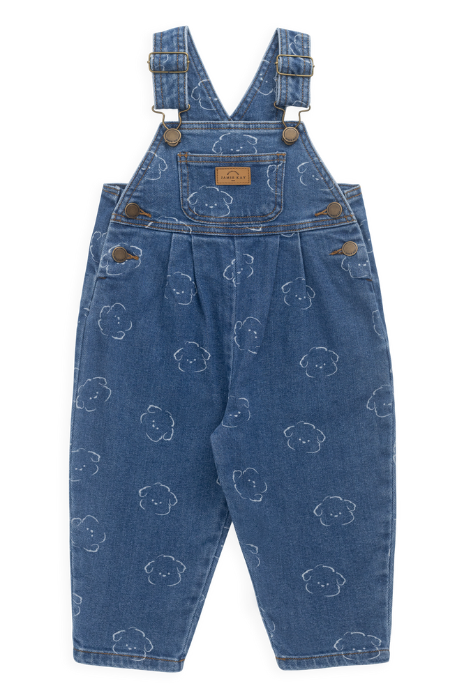 Blue denim overalls with bear pattern on a white background