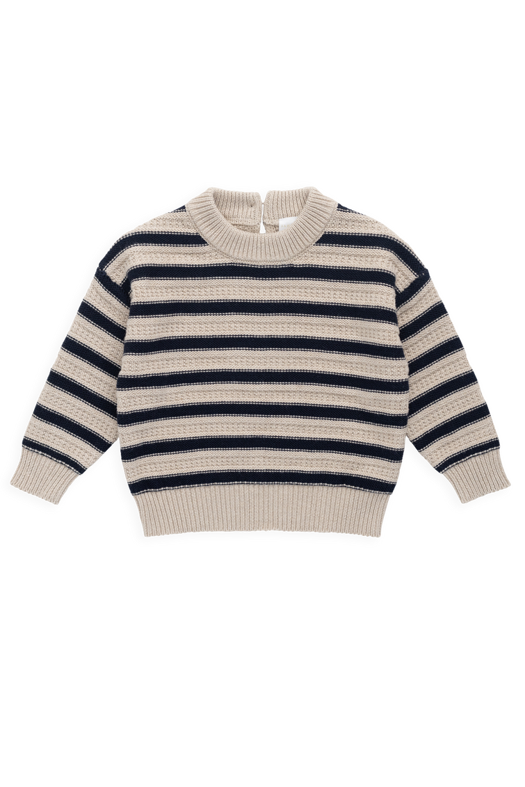 Striped sweater with navy and beige pattern on a white background