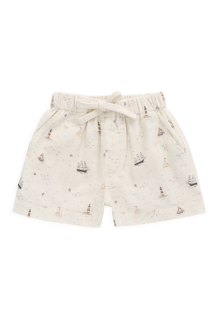 Shorts with sailboat pattern on a white background