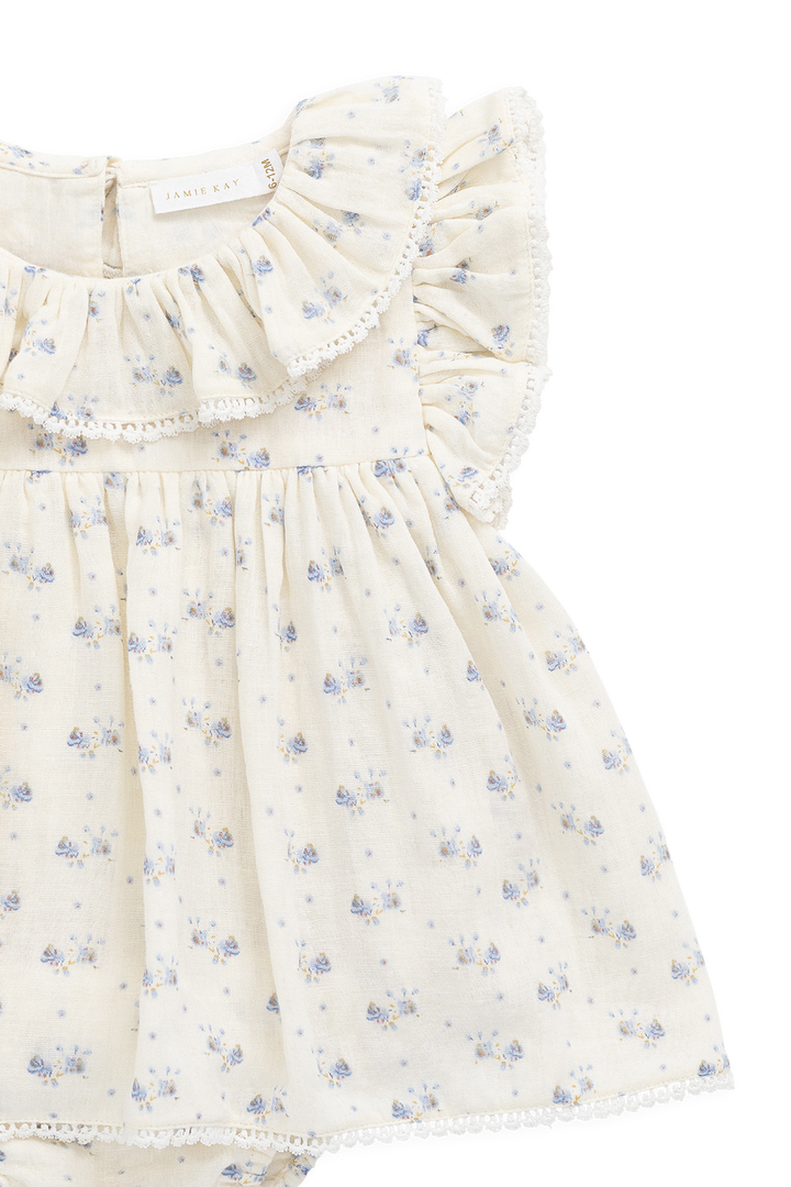 Floral dress with ruffled details on a white background