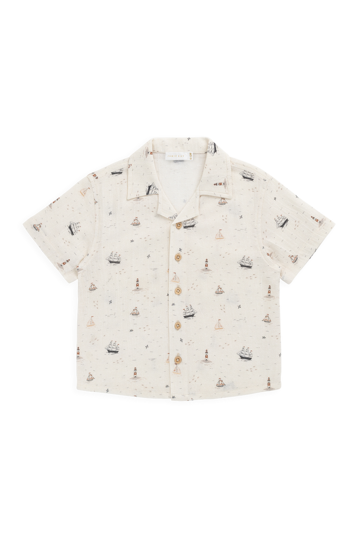 Short-sleeve shirt with ship pattern on a white background