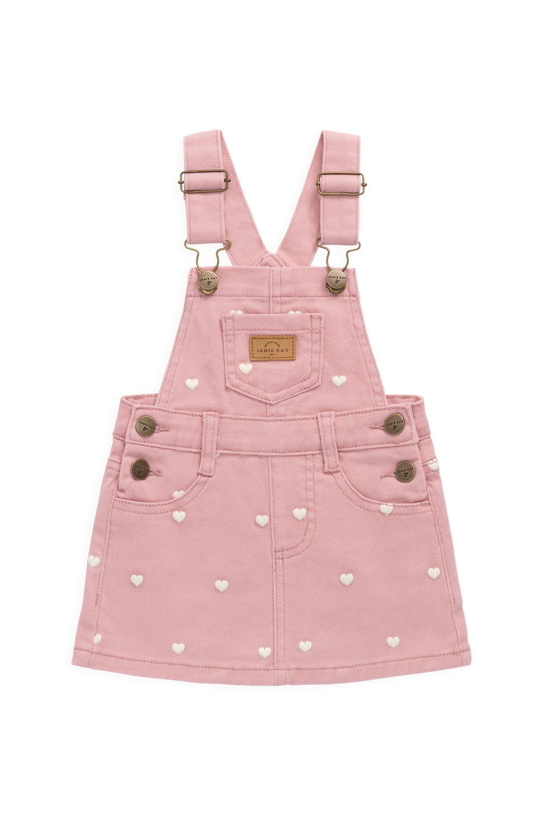Pink denim pinafore dress with heart patterns on a white background