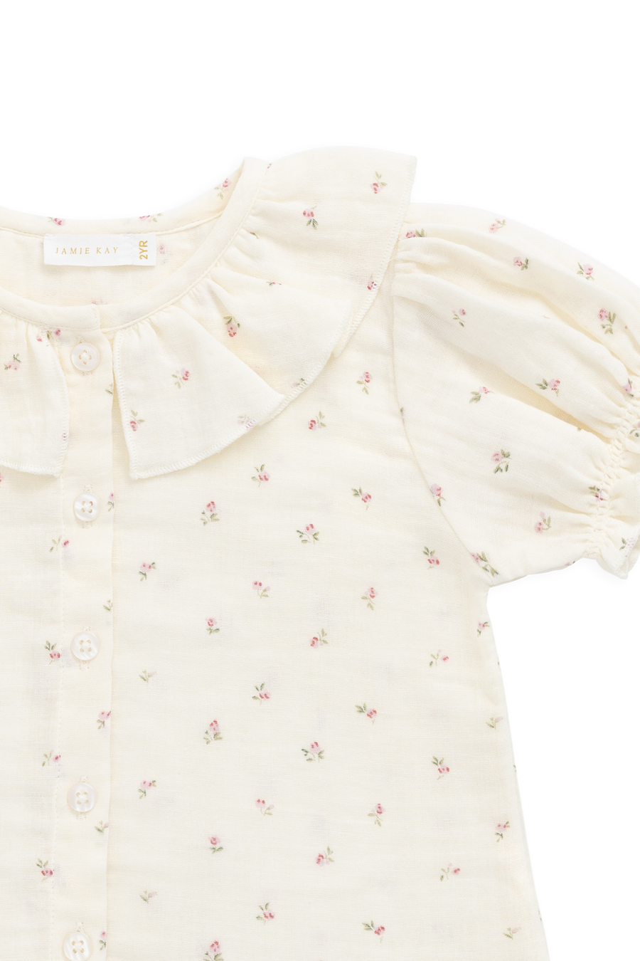 White blouse with floral pattern on a white background