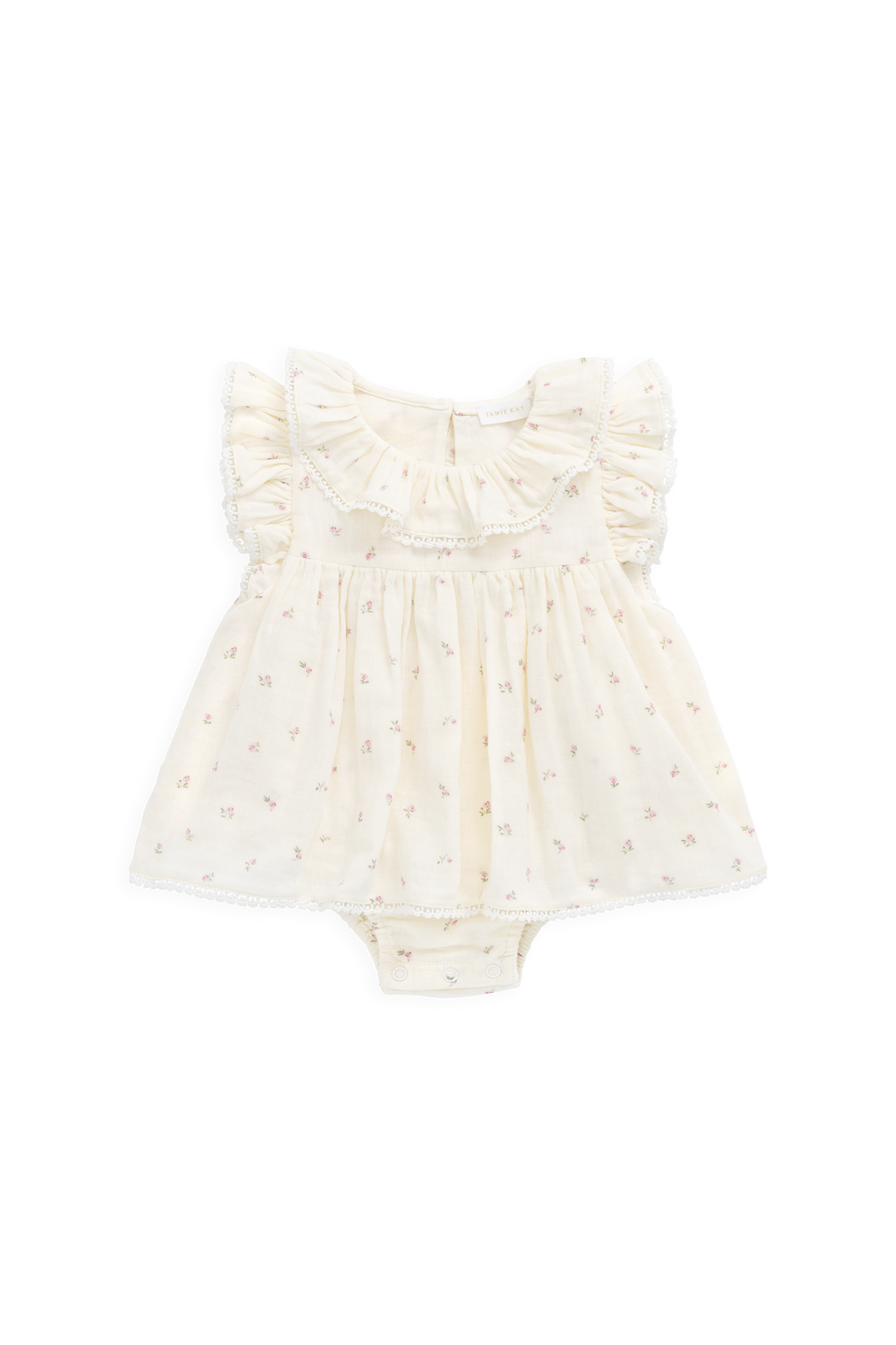 White baby romper with ruffled details on a white background