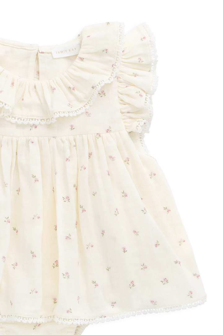 Floral dress with ruffled details on a white background