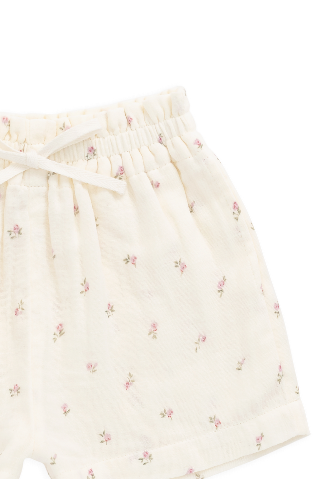 White shorts with subtle floral pattern on a white background